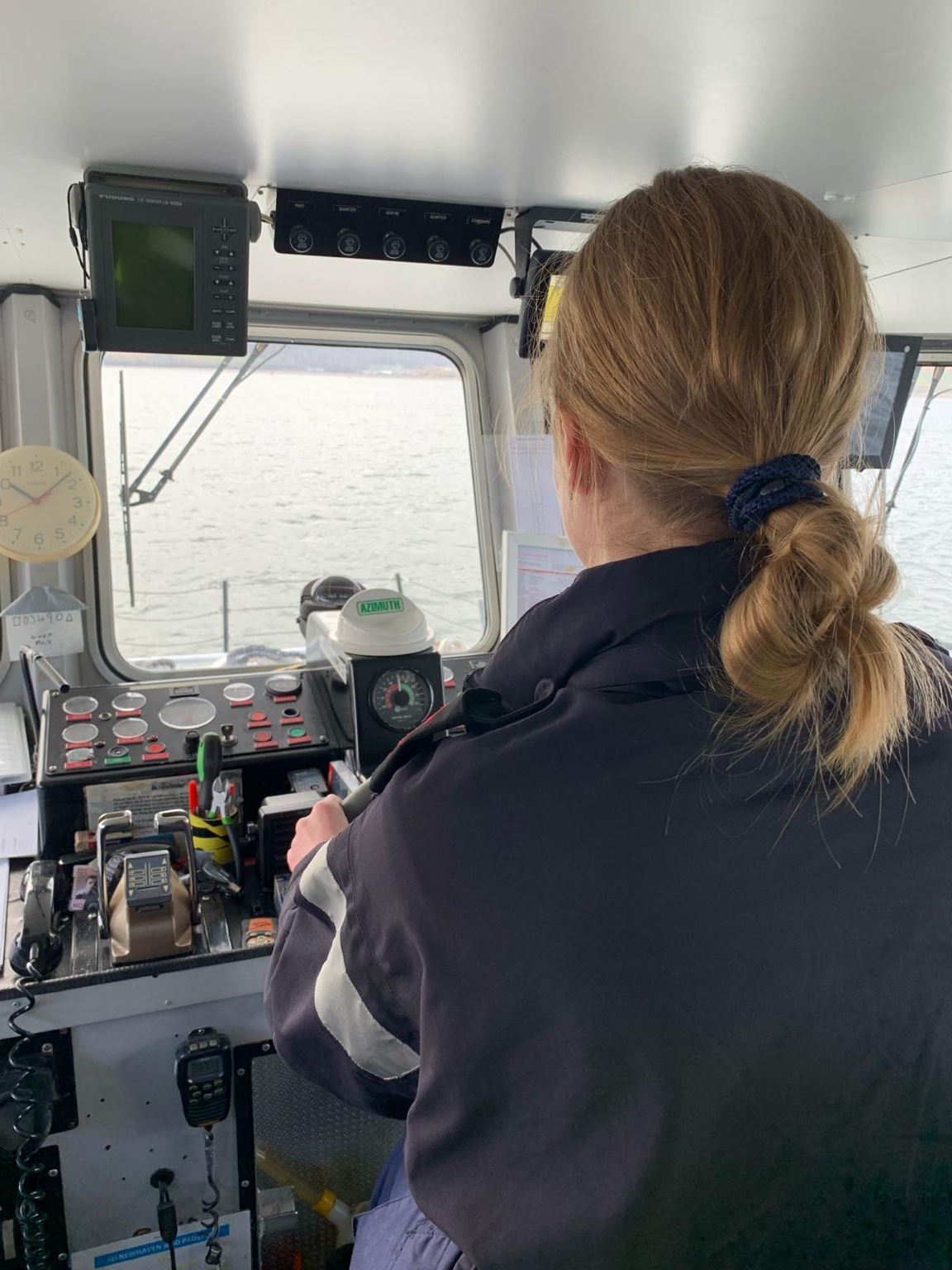 Cadet at the helm of a vessel